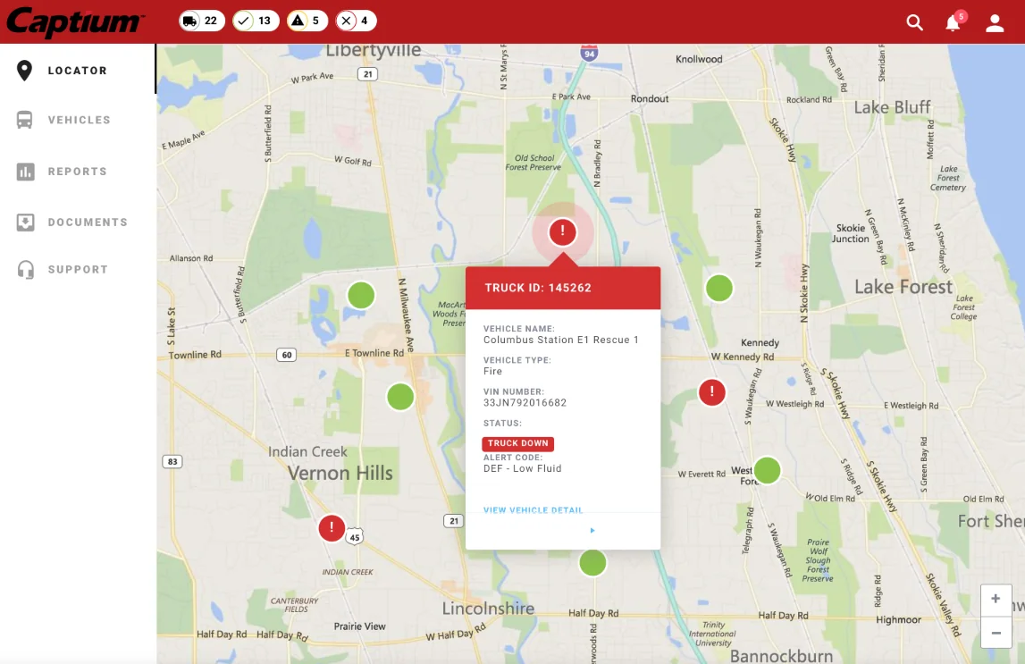 The locator at street level: green and red truck pins, and a red pin open on a truck down for low exhaust fluid